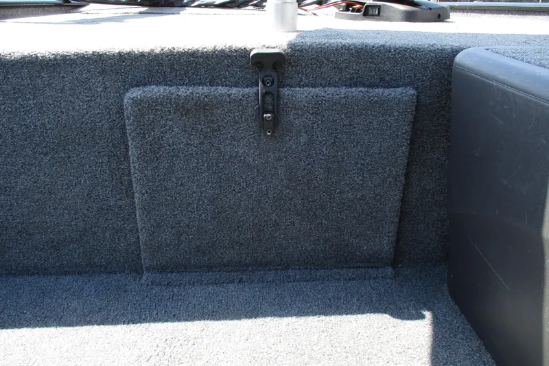 Slide: The Image of 2022 Tracker Bass Tracker Classic XL boat interior storage compartment with carpeted finish. - 13