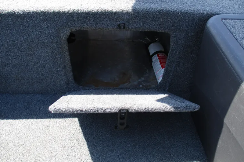 Slide: The Image of Storage compartment with fire extinguisher in 2022 Tracker Bass Tracker Classic XL boat. - 14