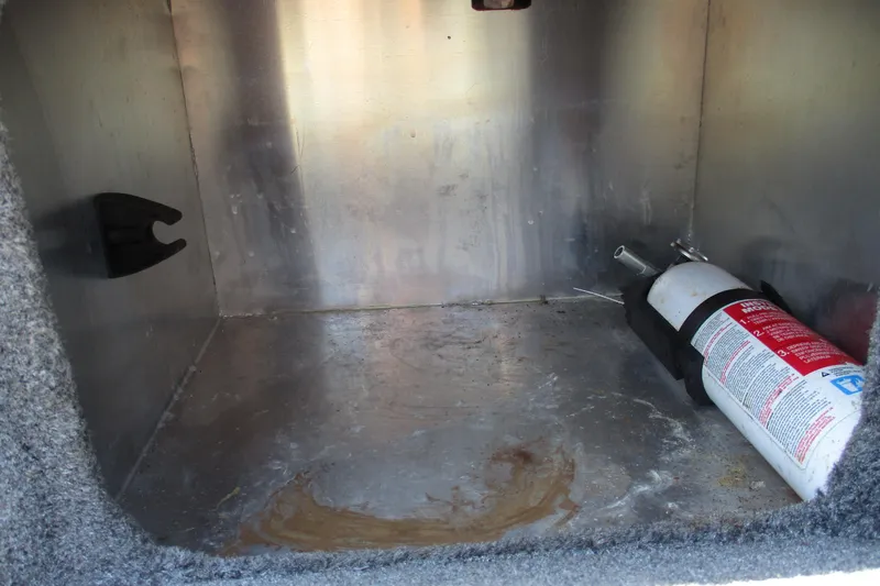 Slide: The Image of Storage compartment with fire extinguisher in 2022 Tracker Bass Tracker Classic XL boat. - 15