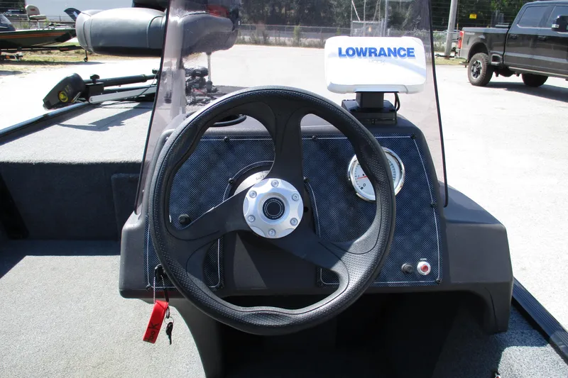 Slide: The Image of Steering console of 2022 Tracker Bass Tracker Classic XL with Lowrance fish finder. - 19
