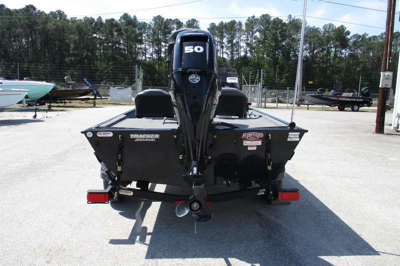 Slide: The Image of 2022 Tracker Bass Tracker Classic XL boat with 50 HP motor, parked outdoors. - 7