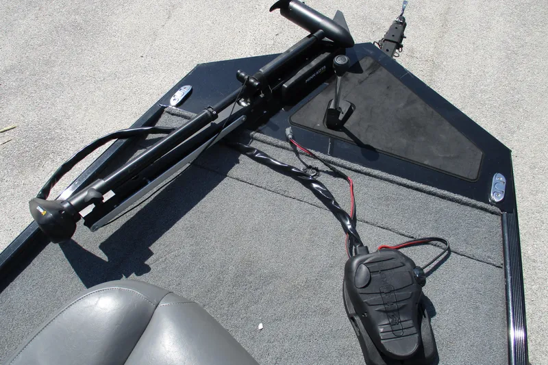 Slide: The Image of 2022 Tracker Bass Tracker Classic XL boat deck with trolling motor and foot pedal. - 9