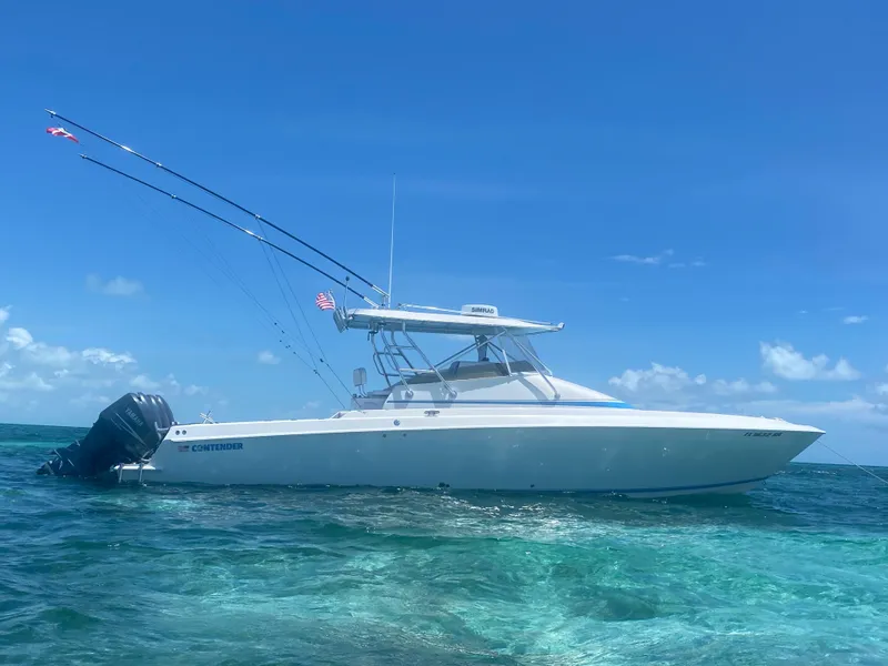 Slide: The Image of 2007 Contender 36 Fish Around boat on clear blue ocean water. - 3