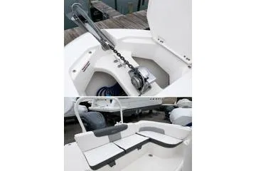 Slide: The Image of 2021 Robalo R242 Explorer boat interior with anchor storage and seating area. - 4