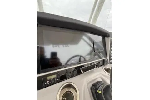 Slide: The Image of 2021 Robalo R242 Explorer dashboard with modern navigation equipment. - 8