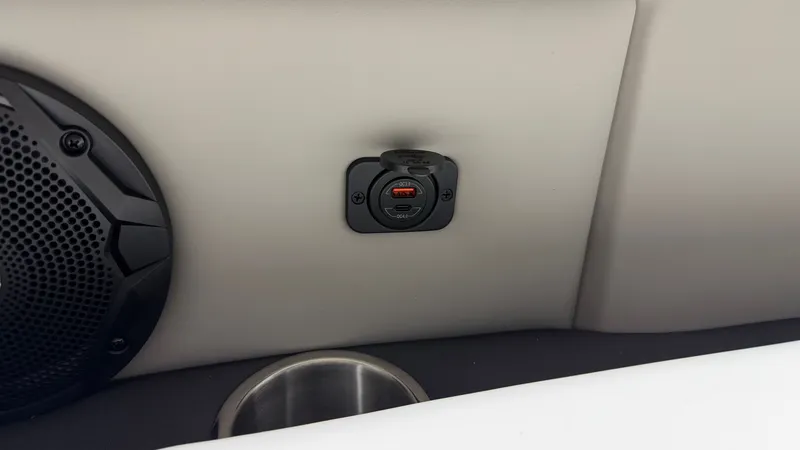 Slide: The Image of Close-up of a USB port and speaker in a boat. - 16