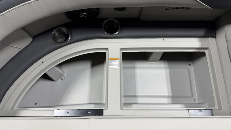 Slide: The Image of Interior view of a 2026 Barletta SANZA22UC with storage compartments and cup holders. - 18