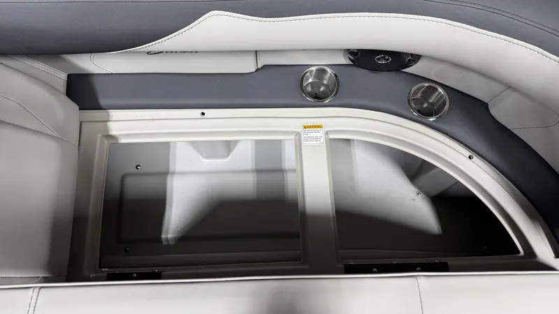 Slide: The Image of Interior view of a Barletta SANZA22UC boat with gray and white upholstery and cup holders. - 25