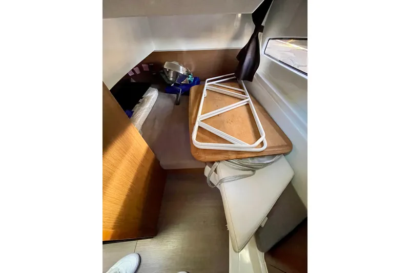 Slide: The Image of Interior cabin of 2020 Beneteau Antares 9 OB with wooden surfaces and storage. - 20
