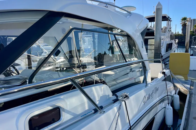 Slide: The Image of 2020 Beneteau Antares 9 OB docked at marina, side view with reflections. - 26
