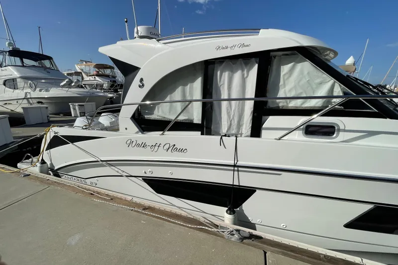 Slide: The Image of 2020 Beneteau Antares 9 OB docked at marina under clear blue sky. - 30