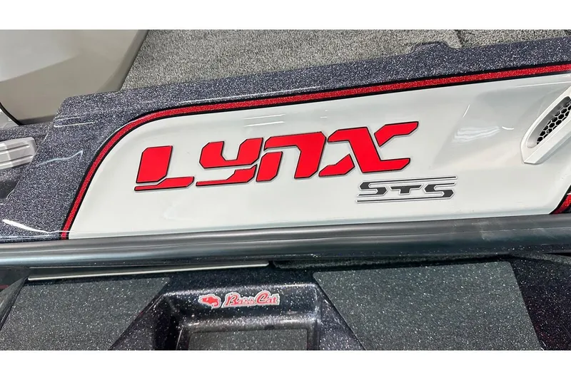 Slide: The Image of 2026 Bass Cat Lynx STS logo on a sleek boat surface. - 12