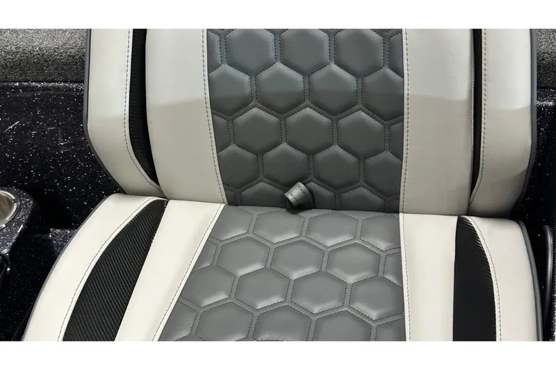 Slide: The Image of 2026 Bass Cat Lynx STS seat with hexagonal pattern and sleek design. - 16