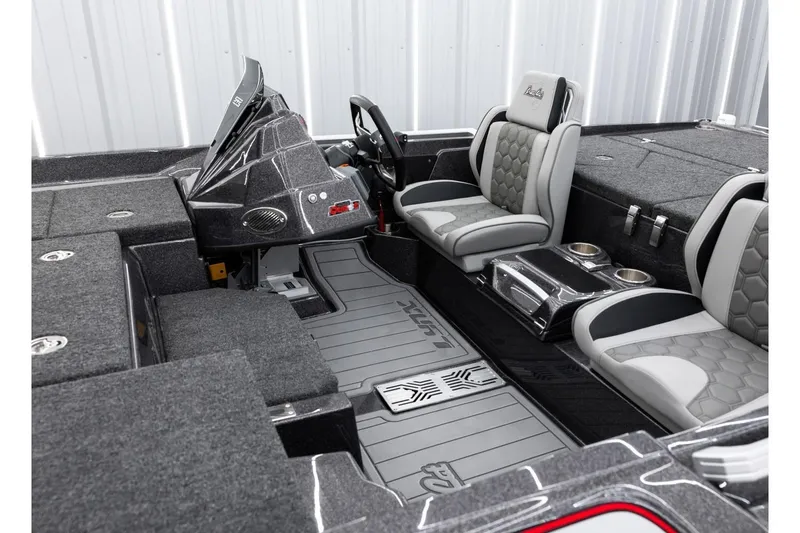 Slide: The Image of 2026 Bass Cat Lynx STS boat interior with sleek seating and modern dashboard design. - 3