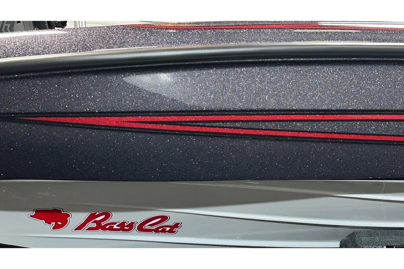 Slide: The Image of 2026 Bass Cat Lynx STS boat with glittery finish and red accents. - 6