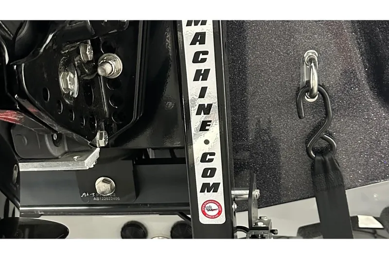 Slide: The Image of 2026 Bass Cat Lynx STS boat detail with metal components and hook attachment. - 8