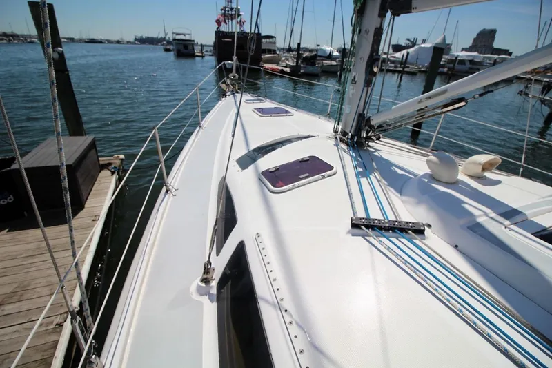 Slide: The Image of Sailboat docked at marina, Hunter 410 model, year 2000, with clear blue skies. - 10