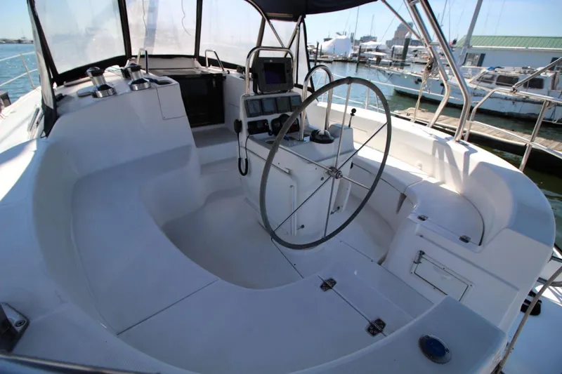 Slide: The Image of Cockpit of a 2000 Hunter 410 sailboat with steering wheel and navigation equipment. - 13