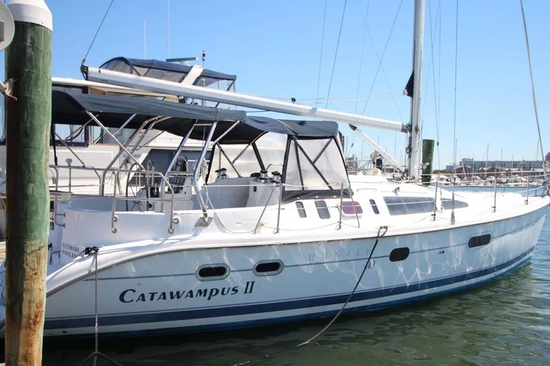 Slide: The Image of Sailboat "Catawampus II," Hunter 410, 2000 model, docked in a marina. - 2