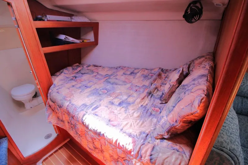 Slide: The Image of Cozy cabin interior of 2000 Hunter 410 yacht with bed and adjacent bathroom. - 21
