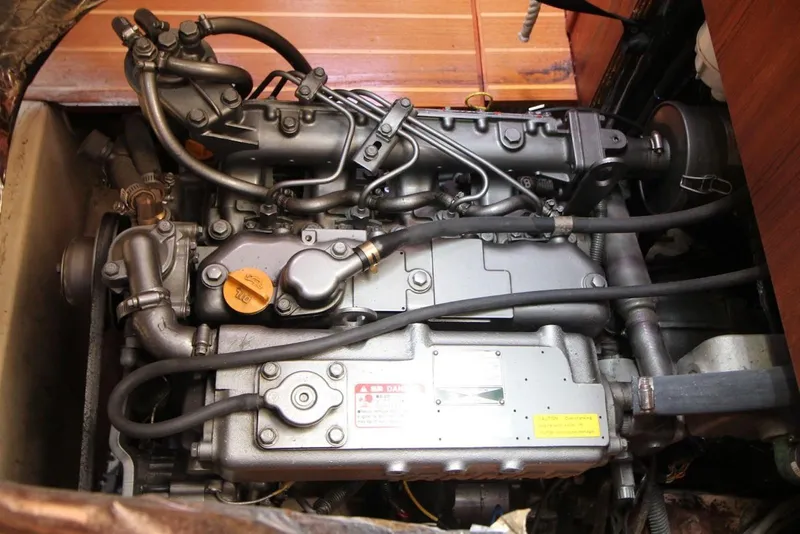 Slide: The Image of Engine of a 2000 Hunter 410 sailboat, showcasing intricate mechanical components. - 27