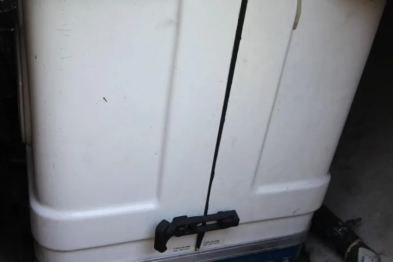 Slide: The Image of White storage compartment on a 2000 Hunter 410 boat. - 28