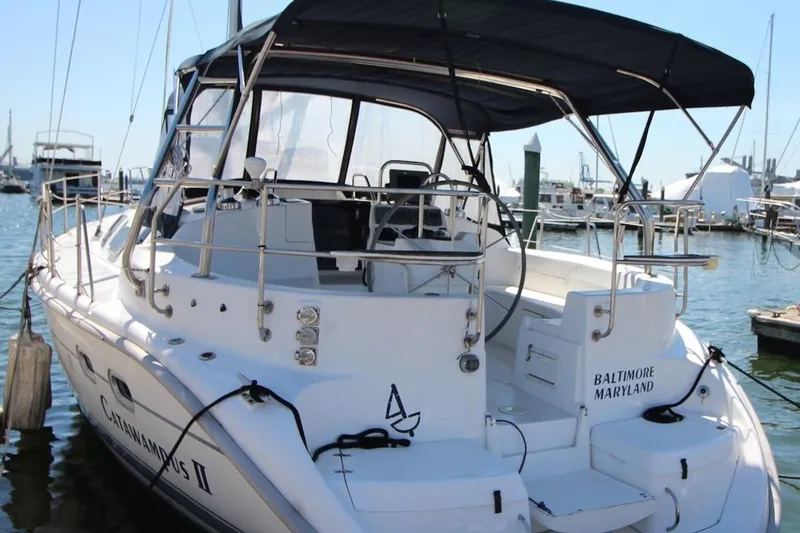 Slide: The Image of Hunter 410 sailboat docked in Baltimore, Maryland, featuring sleek design and spacious deck. - 4