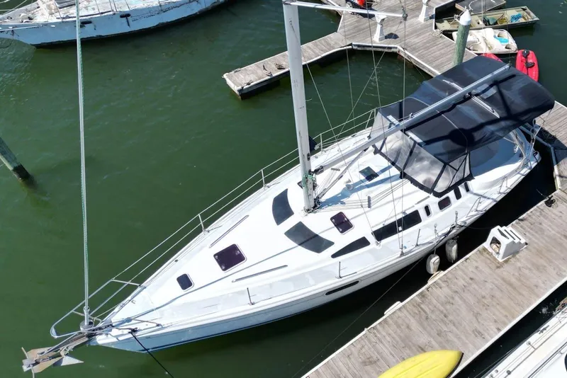 Slide: The Image of Aerial view of a 2000 Hunter 410 sailboat docked at a marina. - 7