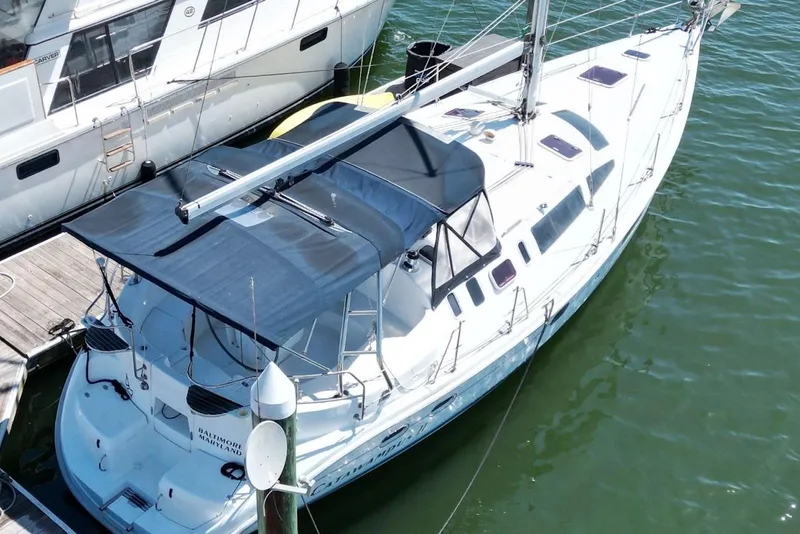 Slide: The Image of Sailboat docked in marina, Hunter 410 model, year 2000. - 9