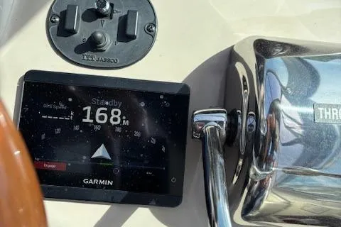 Slide: The Image of Garmin GPS and radio on 2003 Sea Ray 340 Sundancer dashboard. - 20