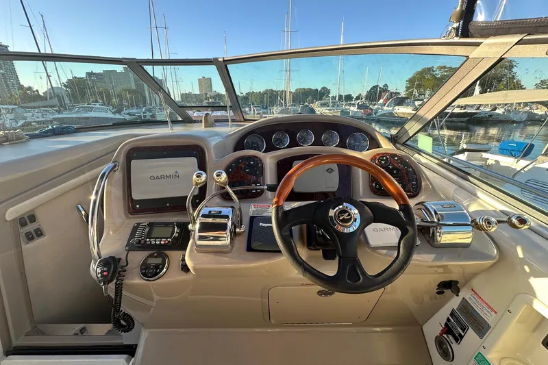 Slide: The Image of Cockpit of 2003 Sea Ray 340 Sundancer with Garmin navigation system and steering wheel. - 29