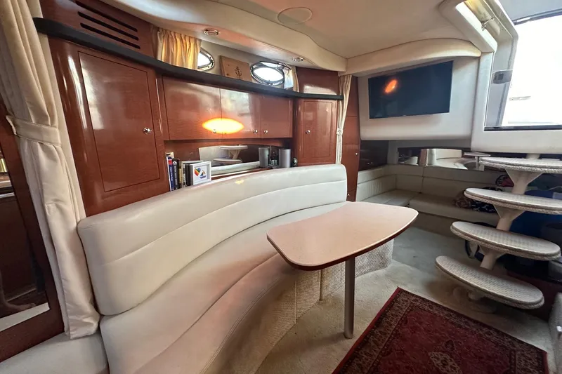 Slide: The Image of Luxurious interior of 2003 Sea Ray 340 Sundancer yacht with elegant seating and cabinetry. - 30