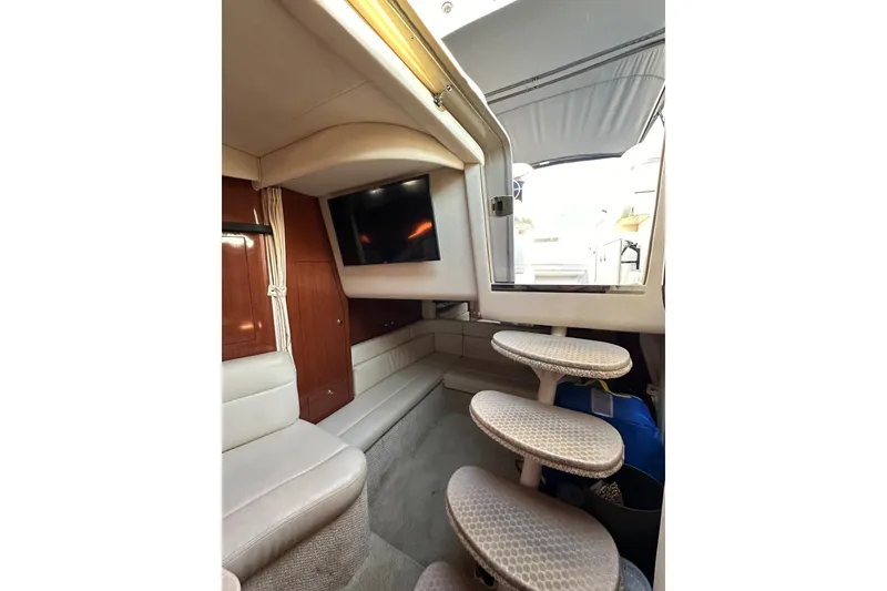 Slide: The Image of Interior of 2003 Sea Ray 340 Sundancer yacht with seating and steps to deck. - 31