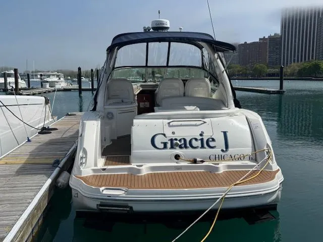 Slide: The Image of Interior cabin of 2003 Sea Ray 340 Sundancer with cozy bed and decorative pillows. - 5