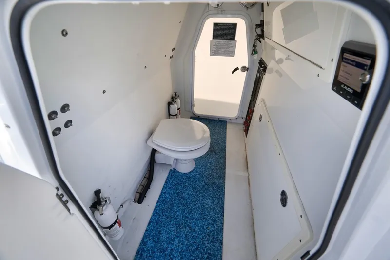 Slide: The Image of Interior of a 2020 Freeman 42LR boat with a compact marine toilet. - 20