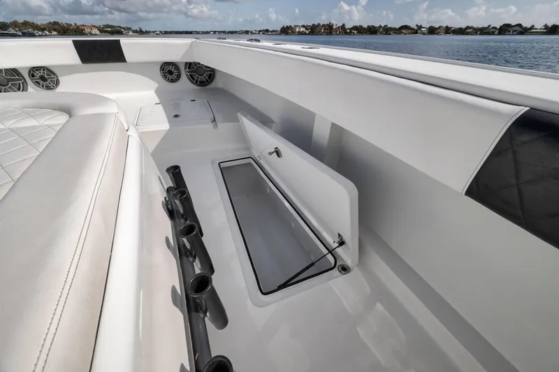 Slide: The Image of Interior view of a 2020 Freeman 42LR boat with seating and storage compartments. - 22