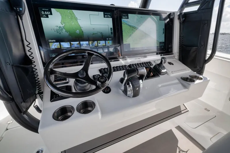 Slide: The Image of Freeman 42LR 2020 boat dashboard with navigation screens and controls. - 29