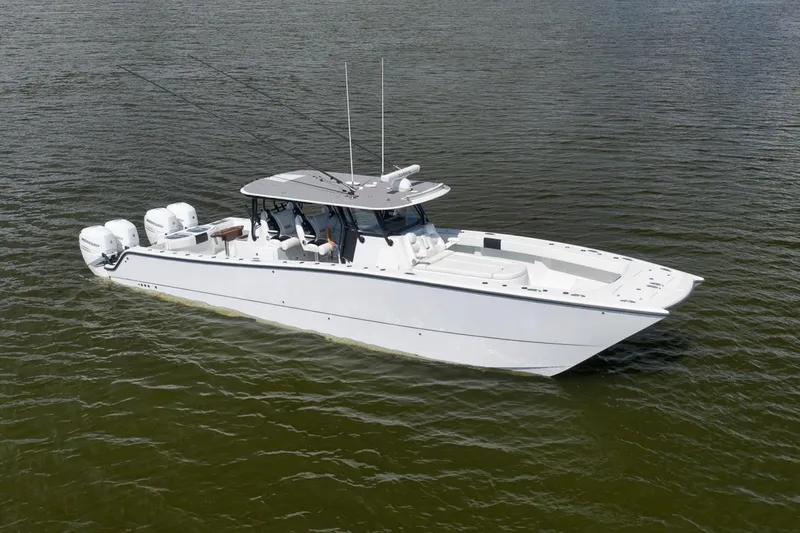 Slide: The Image of 2020 Freeman 42LR boat with four engines on calm water. - 3