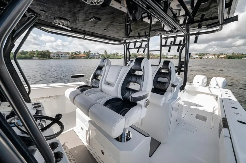 Slide: The Image of Luxurious interior of a 2020 Freeman 42LR boat with plush seating and scenic water view. - 31