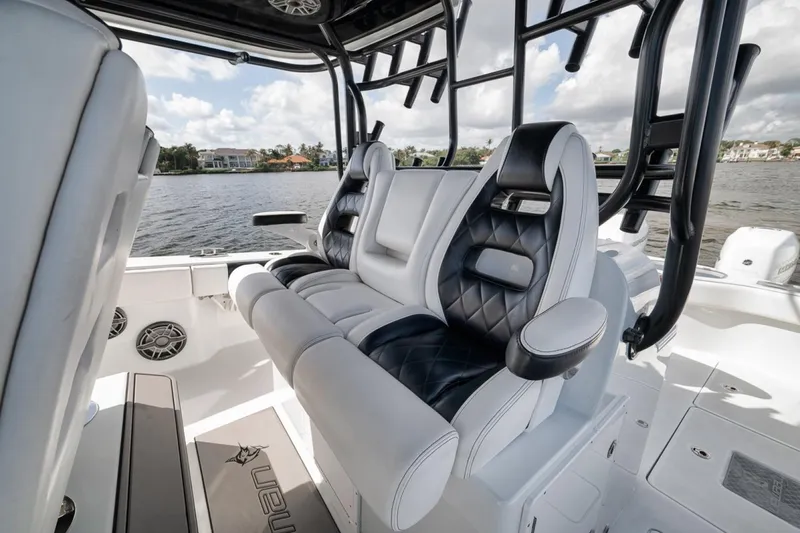 Slide: The Image of Luxurious seating on a 2020 Freeman 42LR boat, featuring black and white upholstery. - 32