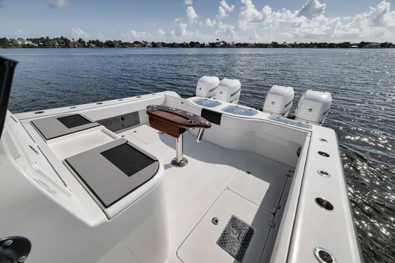 Slide: The Image of Sleek 2020 Freeman 42LR boat with quad engines on calm water. - 33