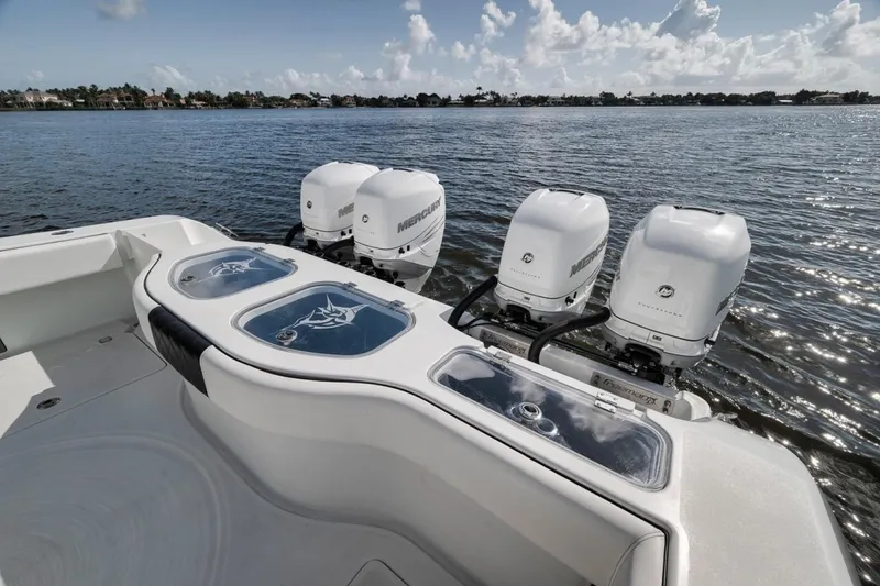 Slide: The Image of Freeman 42LR 2020 boat with four Mercury outboard engines on a calm lake. - 36