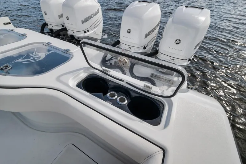 Slide: The Image of Freeman 42LR 2020 boat with Mercury engines, featuring a sleek design and cup holders. - 38