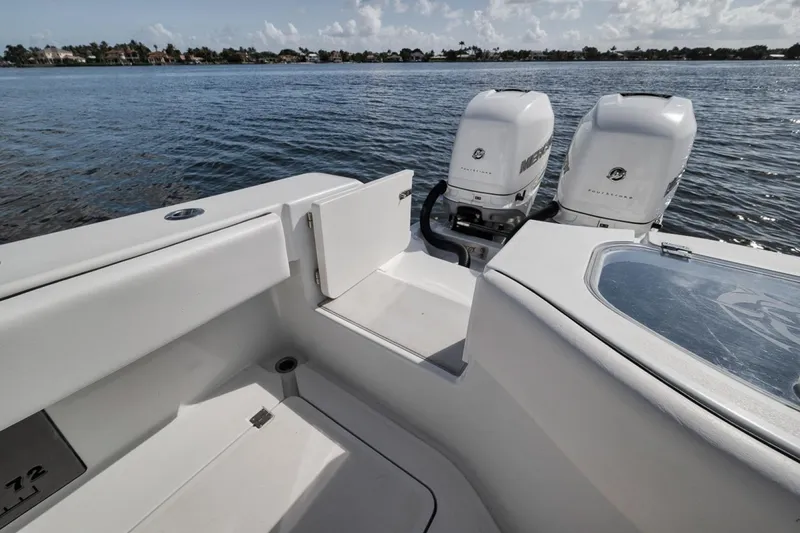 Slide: The Image of Freeman 42LR 2020 boat with dual Mercury engines on a calm lake. - 39