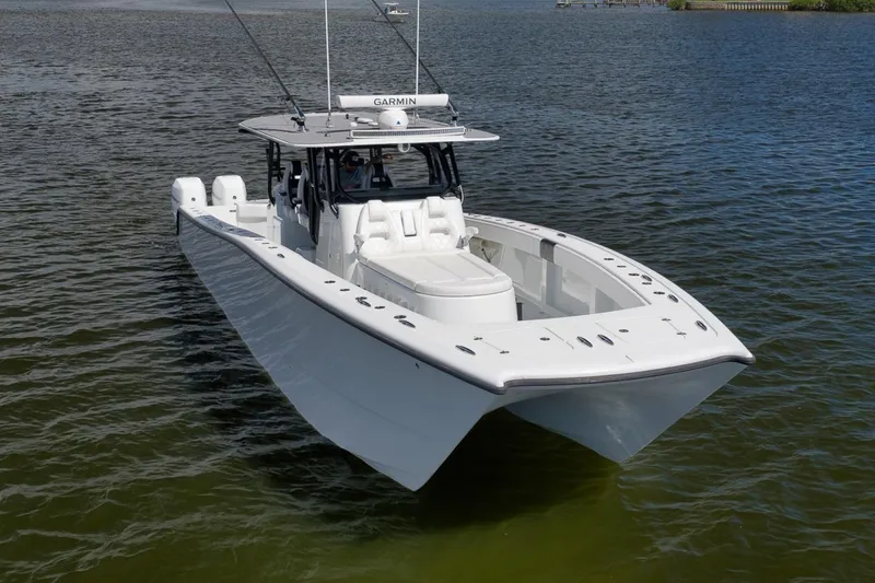 Slide: The Image of 2020 Freeman 42LR boat on water, featuring sleek design and advanced Garmin technology. - 4