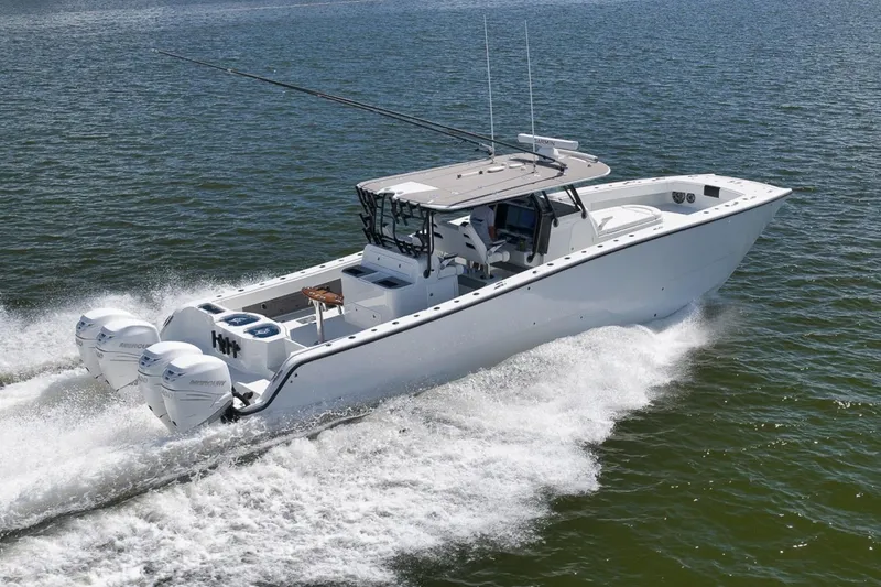 Slide: The Image of 2020 Freeman 42LR boat cruising on open water with powerful engines. - 44