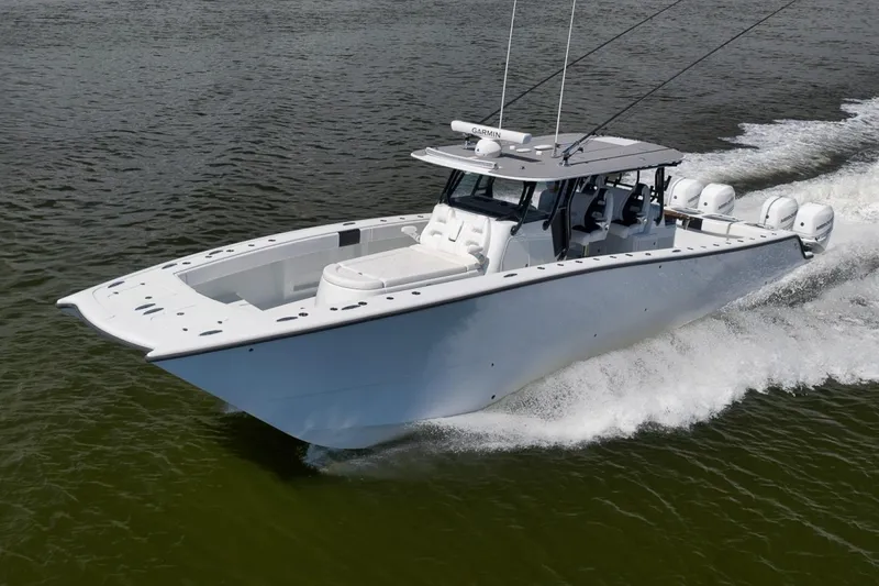 Slide: The Image of 2020 Freeman 42LR boat cruising on water, showcasing sleek design and powerful engines. - 46