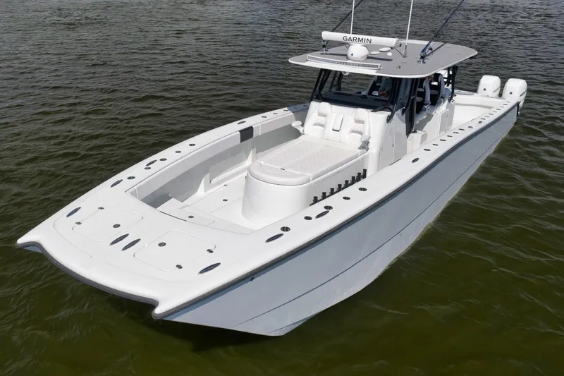 Slide: The Image of 2020 Freeman 42LR boat on water, featuring sleek design and spacious deck. - 5