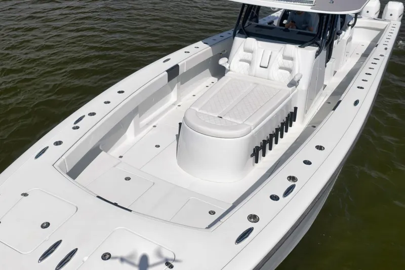 Slide: The Image of 2020 Freeman 42LR boat with spacious deck and luxurious seating on water. - 6