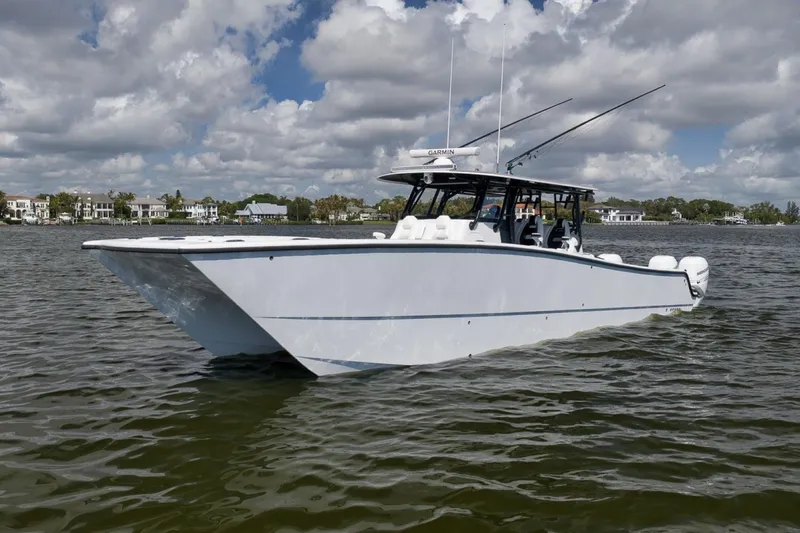 Slide: The Image of 2020 Freeman 42LR boat on calm water under a partly cloudy sky. - 7